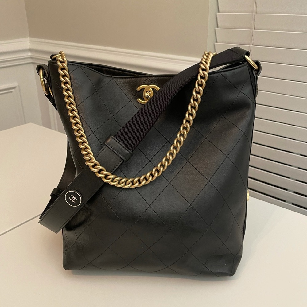 CHANEL
Black Quilted Leather Button Up Hobo Bag